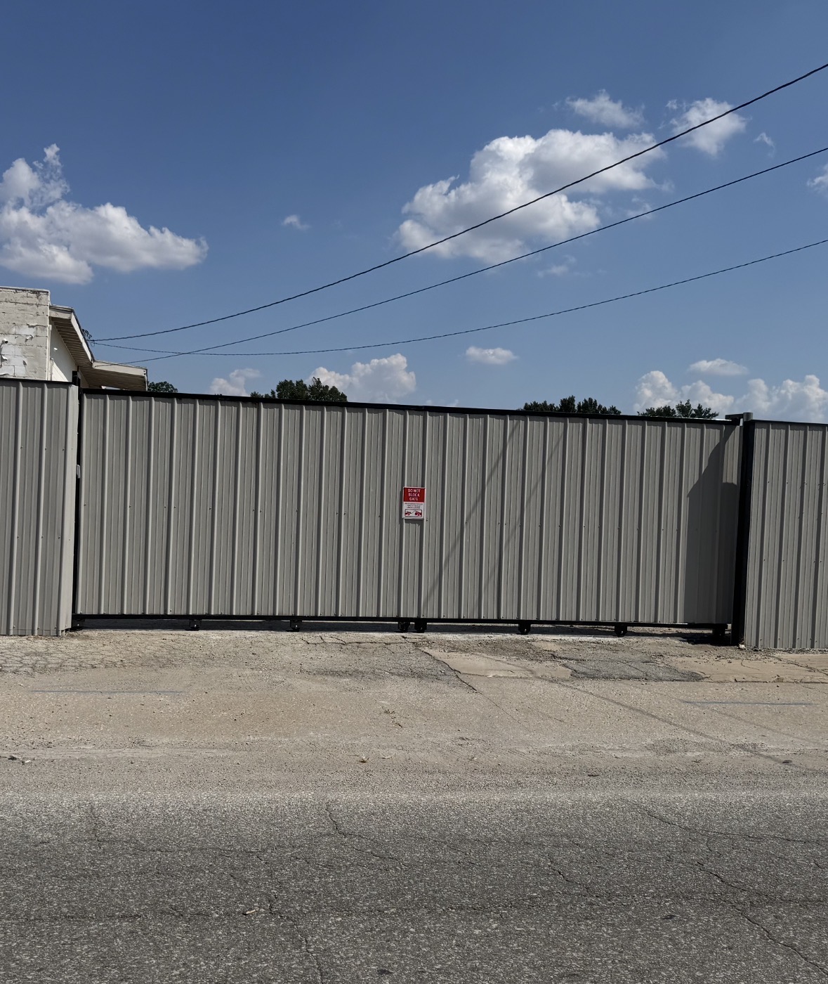 Large commercial steel rolling privacy gate